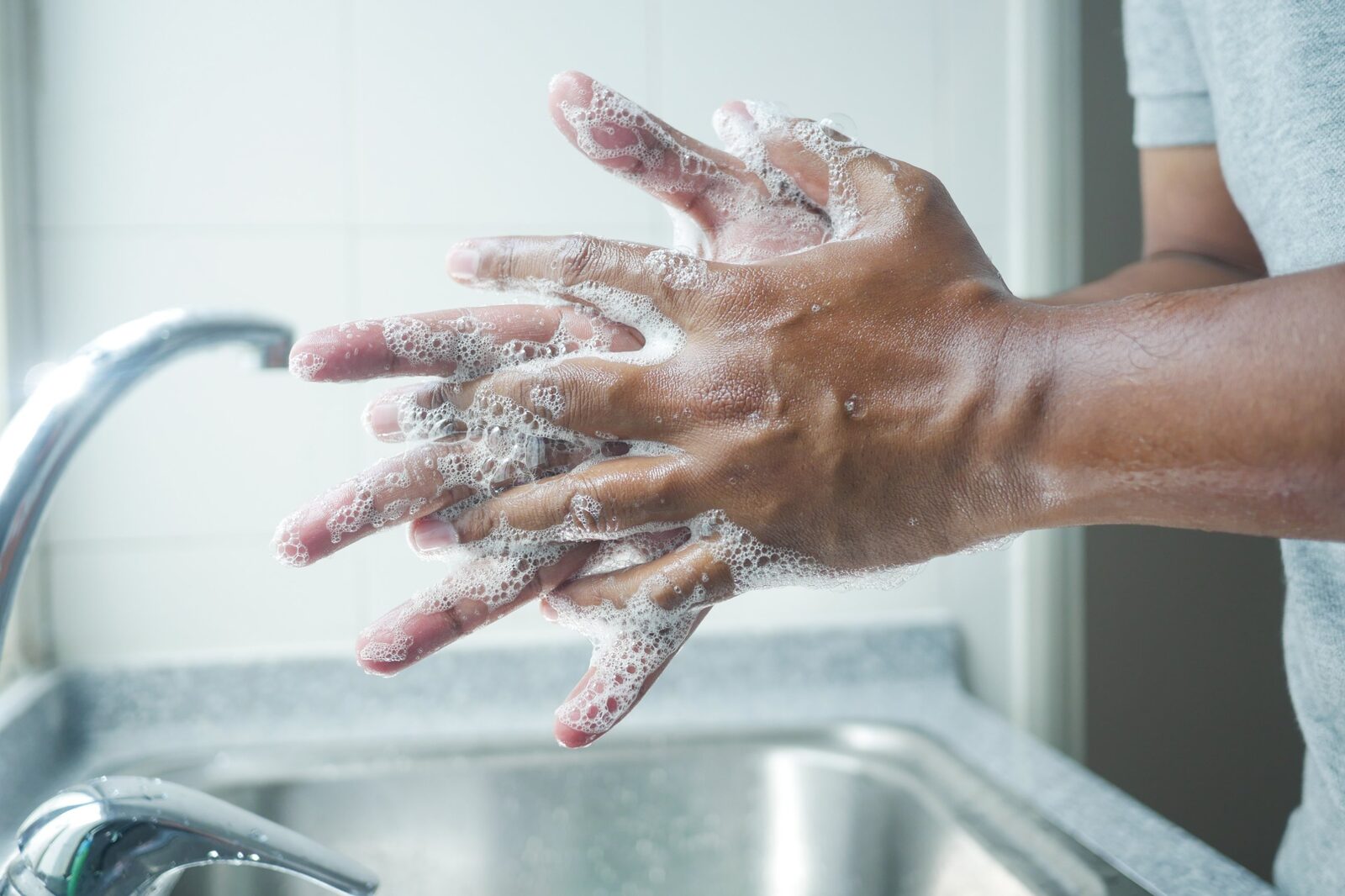 Washing hands with soap before handling banknotes